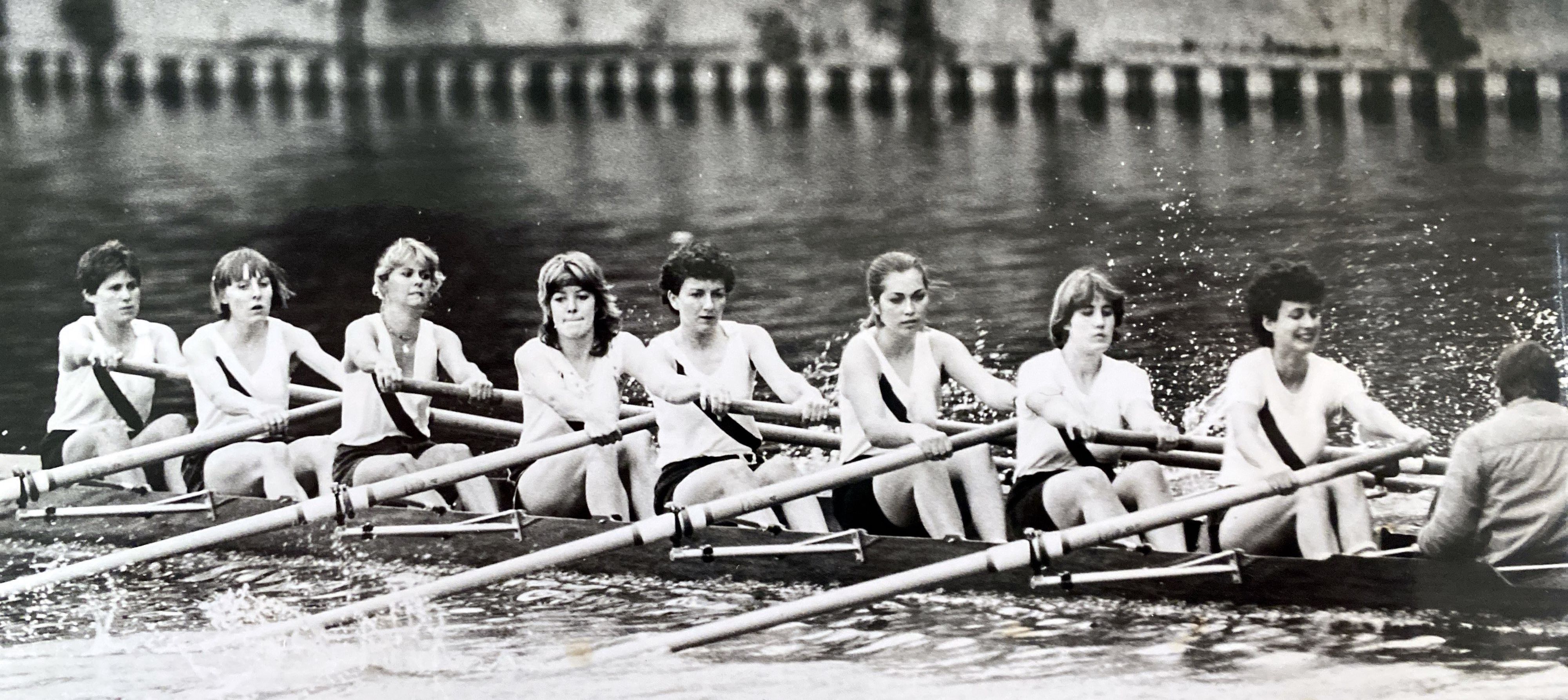 bw photo of women's eight rowing